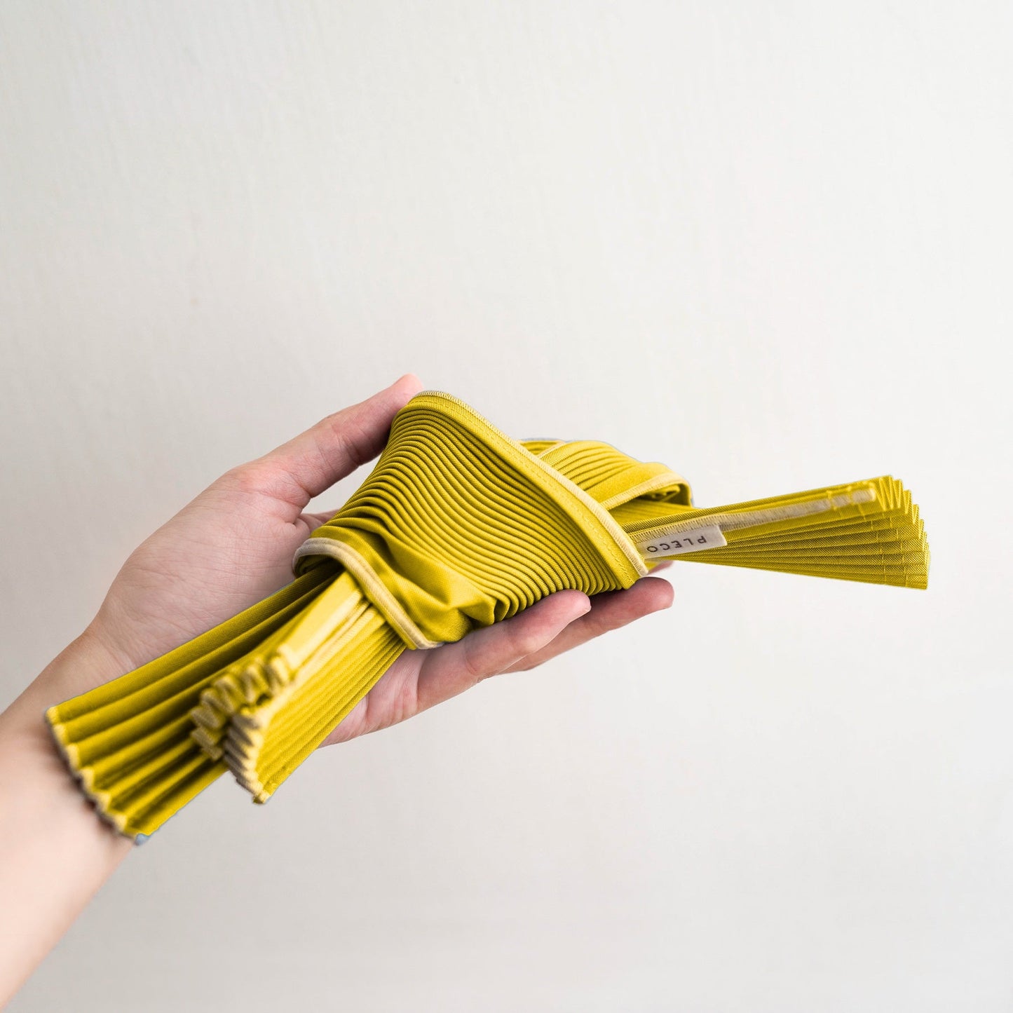Pleco Tate Pleats bag small. yellow